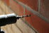 wall tie being installed into a wall